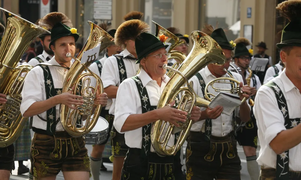 Band walking in a parade playing tubas